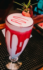 Drink with strawberry and cinnamon made in Brazilian bar