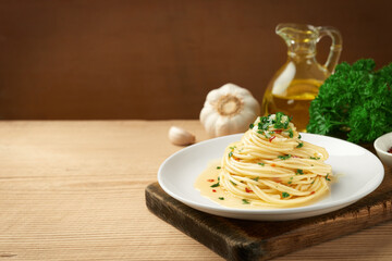 A plate of spaghetti AGLIO E OLIO with copy space