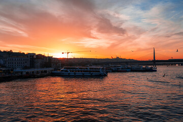 Fototapeta premium Boats in sea and scenic sunset in Istanbul