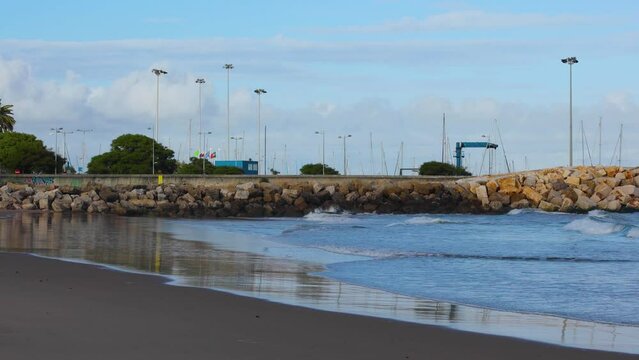 some waves crashing from Tagus River to Santo Amaro Lisbon