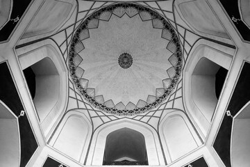 Black and white low angle interior architecture photograph of a vintage historical building with...