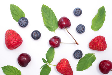 Background of mix berries with free space. Blueberries, strawberries and cherry