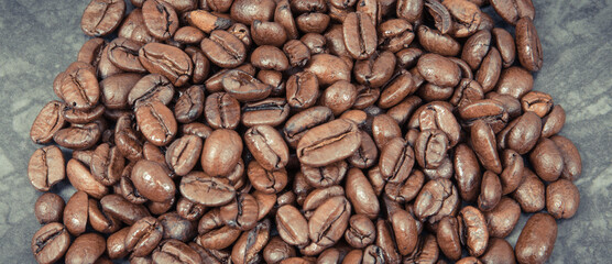 Heap of roasted coffee grains. Structure concrete