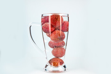 A young Asian girl running towards the sun in the morning