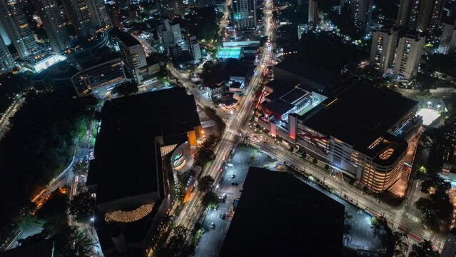 Aerial Hyperlapse view above traffic at a intersection, at night, in Sao Paulo Brasil, America - orbit, time lapse, drone shot nocturnal