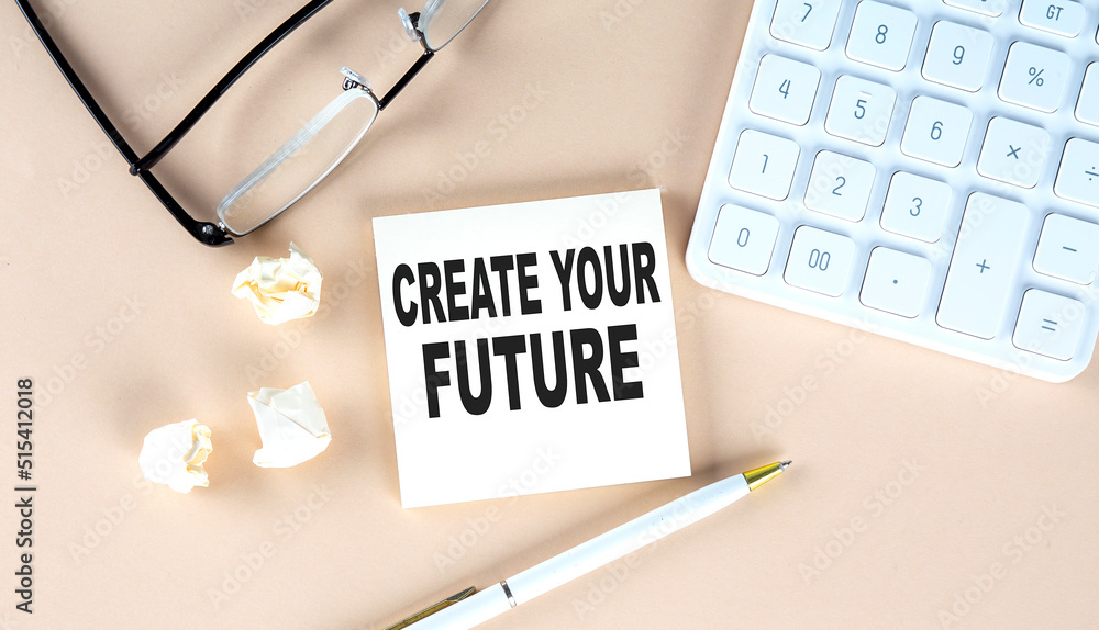 Poster create your future text on sticky with pen ,calculator and glasses on a beige background