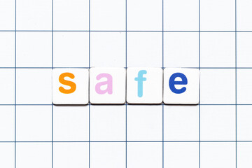 Colorful tile letter in word safe on white grid background