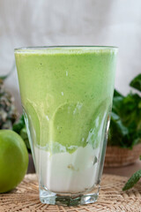 colorful healthy fresh fruit smoothy with assorted ingredients serve in glass.