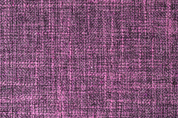Close-up texture of natural purple coarse weave fabric or cloth. Fabric texture of natural cotton or linen textile material. Blue canvas background. Decorative fabric for upholstery, furniture, walls