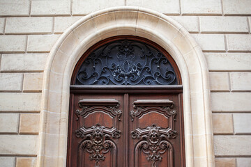 Fototapeta na wymiar Stylish wooden door and stone wall