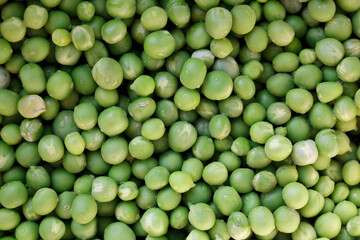 Green peas. Green background. Pea background. View from above.