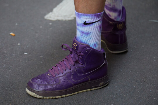 Man with purple leather Nike sneakers and tie dye socks on June 18, 2022 in Milan, Italy