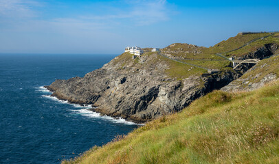 Mizen Head Signal Station lighthouse with dramatic rocky coastline in the Atlantic ocean . County Cork, Ireland.