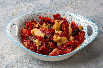 Traditional, delicious Turkish appetizers; Dried tomato appetizer salad with walnuts (Turkish name; Kurutulmus domates mezesi salatasi)