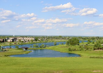 A beautiful view of the lakes in the park on a sunny day.