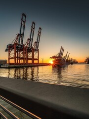 Vertical shot of container terminals for solar-powered mooring systems in the harbor of Hamburg