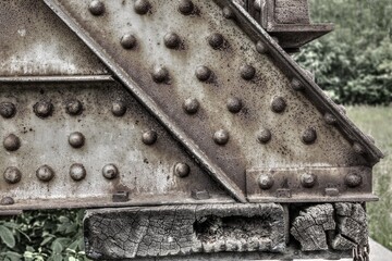 Steel girders and rivets of an old railway bridge