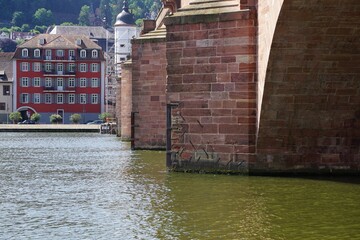 Karl Theodor Bridge ( Old bridge)  with a view of a red building in Heidelberg