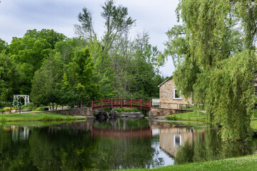 Fototapeta na wymiar Mill pond and bridge Stewart Park Perth Ontario