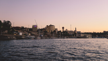 Sunset View to the Panoramic Aswan cityscape with the Palm Trees, Egypt