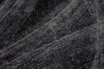 Abstract pattern background image. concrete surface. Modern black tones. Wheel marks on the floor.