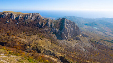 view from mountain ridge to valley under blue sky