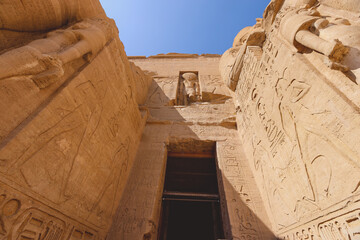 The main view of an Entrance to the Great Temple at Abu Simbel with Ancient Colossal statues of...
