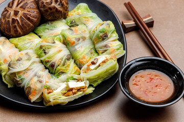 Cabbage wrapped mixed tofu with vegan salad 