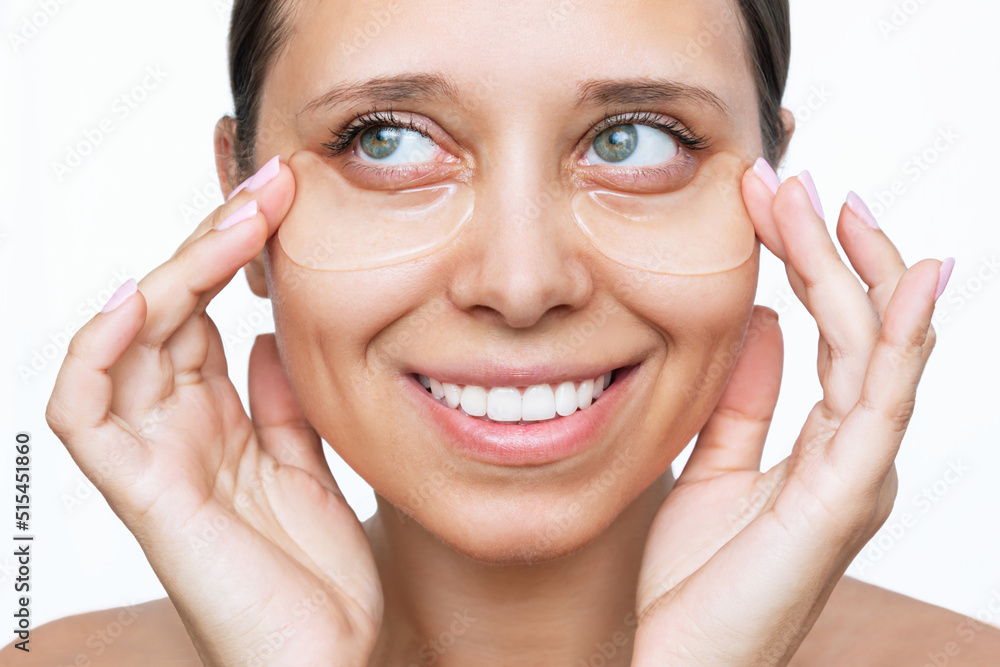 Wall mural portrait of a young attractive caucasian woman with gel colorless transparent patches on the skin un