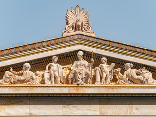 The east gable of the building of the National University of Athens, Greece. Athena, the goddess of...