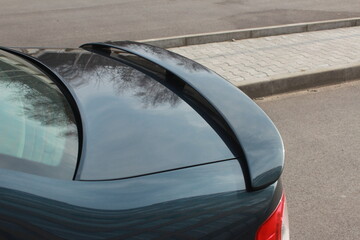Modern car rear trunk spoiler. 