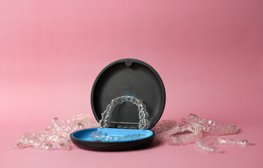 invisible brace in case on pink background