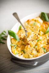 baked cauliflower with vegetables and cheese and scrambled eggs