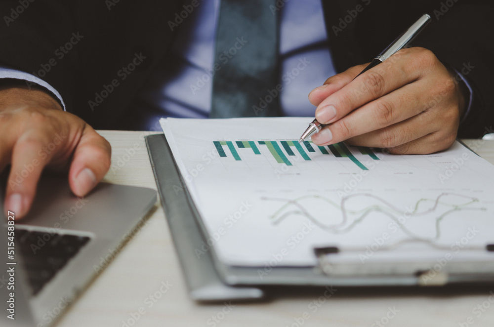 Aufkleber businessman holding pen to work computer graphs and charts data statistical data financial analysis 
