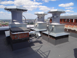 roof fans.exhaust ventilation systems.the fans are installed on a brick base.
