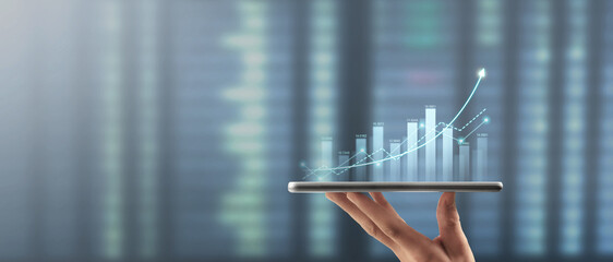 Hand holding smartphone device and touching screen. Stock exchange market concept