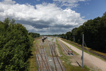 Fototapeta na wymiar The old railway yard with wagons and trainsets in storage near the village called Onnen, province of Drenthe, the Netherlands