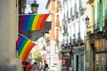 Streets of the Madrid neighborhood of Chueca adorned with rainbow flags on the occasion of LGBTI and gay pride week, during a sunny summer day
