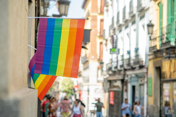 Streets of the Madrid neighborhood of Chueca adorned with rainbow flags on the occasion of LGBTI and gay pride week, during a sunny summer day