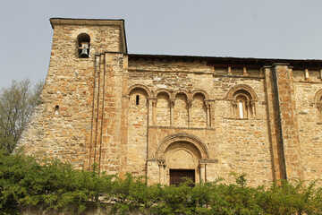 Fototapeta na wymiar View of the church of San Miguel in Corullon, Leon (Spain). Built at the beginning of the 12th century, in the Romanesque style. It has a single nave with three sections topped by a semicircular apse