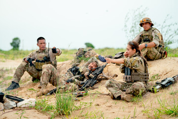 Group of military or soldier stay and relax during prepare for fight to enemy in battle field with...