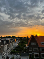 Picturesque view of city street with beautiful buildings at sunrise