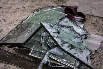 Piles of broken glass from windows from the apartment buildings were was knocked out by the blast...
