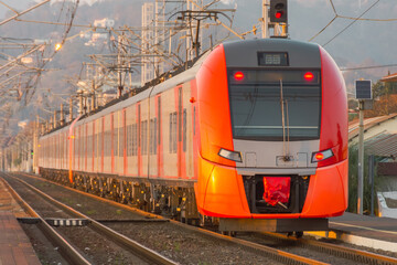 Express train leaves far from the station along the route.