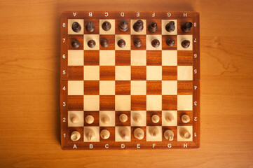 chessboard with pieces top down view