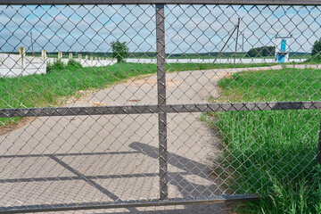 Brass padlock was locked with wire mesh door fence