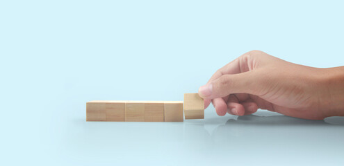 Wooden blocks in hand space and word decide