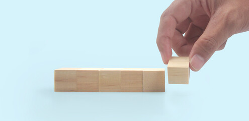 Wooden blocks in hand space and word decide