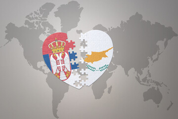 puzzle heart with the national flag of cyprus and serbia on a world map background.Concept.