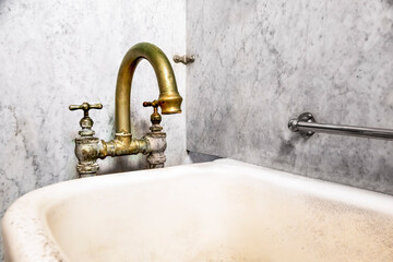This private bathtub with faucet was used in one of the historic buildings on bathhouse row in Hot Springs National Park, Arkansas. The warm mineral water baths were popular for many years. - 515475886
